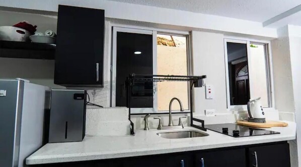 Fridge, microwave, stovetop, coffee/tea maker