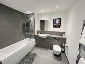 Shower, hair dryer, towels, soap