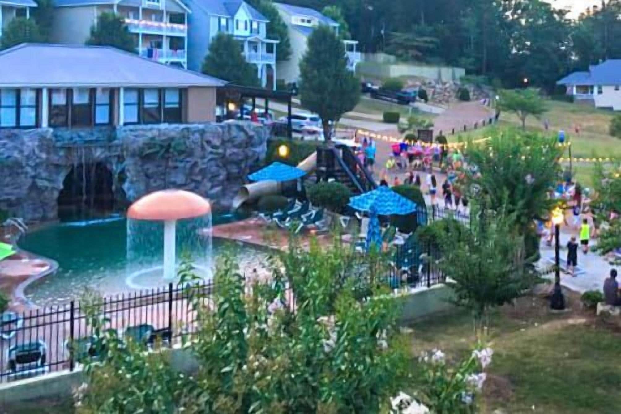 A resort with a water park, including a waterfall and slides.