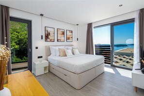 Sleep comfortably in this spacious room with a large bed, nightstand, and desk.