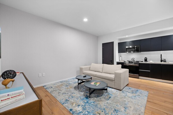 Luxury Condo, 1 King Bed with Sofa bed, Balcony, City View | Living area | 45-inch Smart TV with cable channels