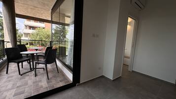 Appartement Deluxe, vue jardin | Terrasse/Patio