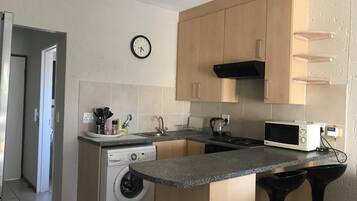 Fridge, microwave, cookware/dishes/utensils