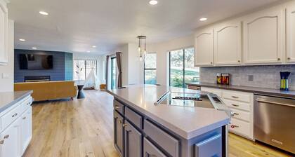 Two-story golf course-adjacent getaway with a patio, washer/dryer, central AC