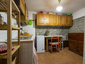 Fridge, microwave, cookware/dishes/utensils, dining tables