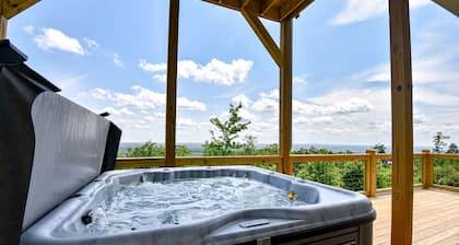 Stunning three-story home with a hot tub, firepit, washer/dryer, & views