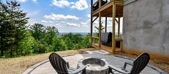 Stunning three-story home with a hot tub, firepit, washer/dryer, & views