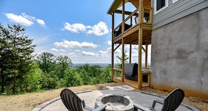 Stunning three-story home with a hot tub, firepit, washer/dryer, & views