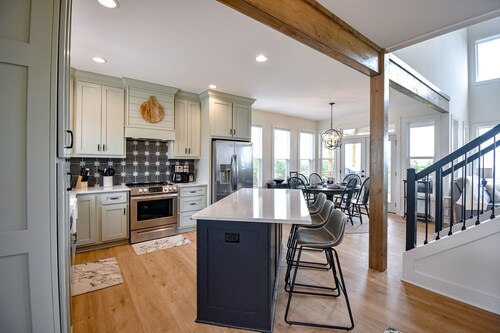 Stunning three-story home with a hot tub, firepit, washer/dryer, & views
