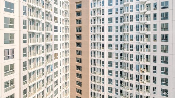 A high-rise residential building with multiple balconies and a uniform facade. - Comfort And Nice 2Br At Tokyo Riverside Pik 2 Apartment (Teluknaga)