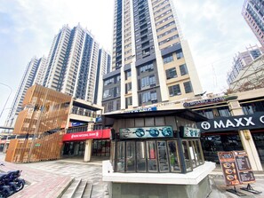 A commercial area with high-rise buildings, a Nobu National Bank, and a Maxx restaurant. - Good Deal And Modern Look 3Br Meikarta Apartment (Cikarang)