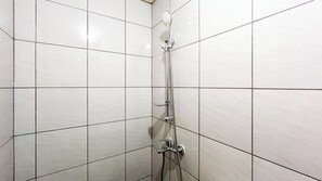 Studio | Bathroom | Shower, towels, soap, shampoo - Enjoy Living Studio (No Kitchen) Bandaraya - Tallasa City Makassar Apartment (Makassar)