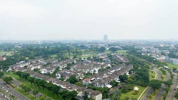 A residential area with houses, roads, and greenery.