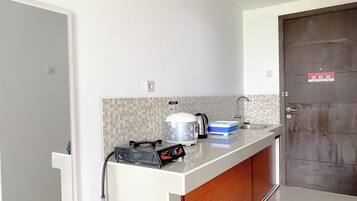 Estudio | Cocina privada | Parrilla de estufa y tetera eléctrica