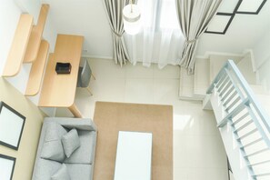 Studio | Living area - Good Deal Studio Loft Mezzanine (No Kitchen) At Kubikahomy Apartment (Pagedangan)