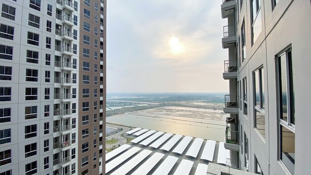 A high-rise building with multiple balconies and large windows. - Comfy And Best Deal Studio At Tokyo Riverside Pik 2 Apartment (Teluknaga)