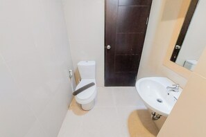 Estudio | Baño | Regadera y toallas 