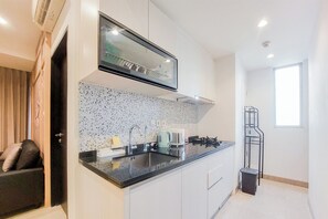 Apartment | Private kitchen | Full-size fridge, stovetop - Modern Look And Cozy 1Br Branz Bsd City Apartment (Pagedangan)