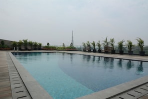 Outdoor pool - Spacious And Comfy 1Br Tree Park City Bsd Apartment (South Tangerang)