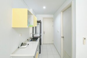 Studio | Private kitchen - Cozy Stay Studio At Patraland Urbano Apartment (Bekasi)