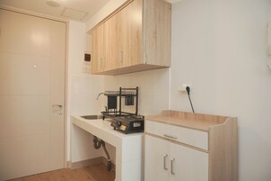 Monolocale | Cucina privata | Frigorifero, piano cottura, risottiera