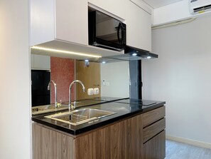 Appartement | Cuisine privée | Réfrigérateur, plaque de cuisson, cuiseur de riz