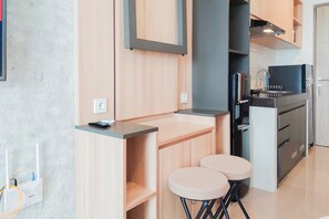 Monolocale | Cucina privata | Frigorifero, piano cottura, risottiera