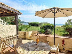 Enjoy a glass of wine on the patio overlooking the sea and hills.