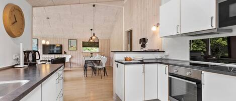 Fridge, stovetop, dishwasher, coffee/tea maker