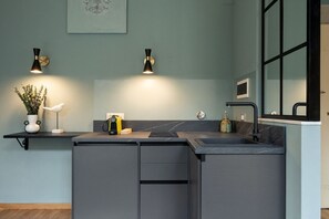 Fridge, microwave, stovetop, coffee/tea maker