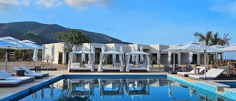 Outdoor pool, open 9:00 AM to 6:00 PM, pool umbrellas, pool loungers