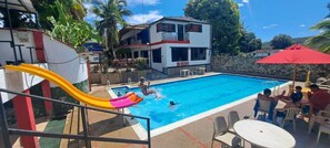 Outdoor pool, open 8:30 AM to midnight, pool umbrellas
