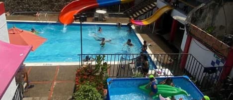 Outdoor pool, open 8:30 AM to midnight, pool umbrellas