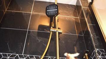 Shower, hair dryer, towels, soap