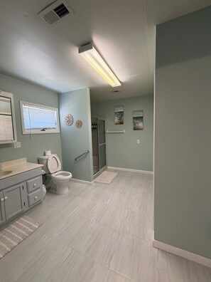 Shower, hair dryer, towels, soap