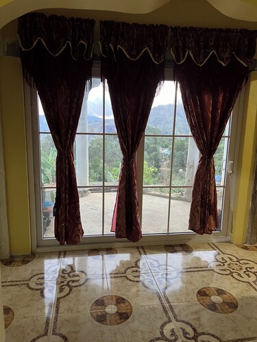 O-T on the rise Bed and Breakfast, three miles away from the Blue Mountain Peak.