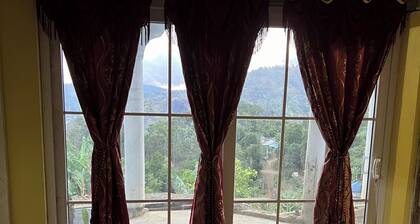 O-T on the rise Bed and Breakfast, three miles away from the Blue Mountain Peak.