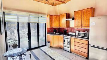 Fridge, stovetop, coffee/tea maker, cookware/dishes/utensils