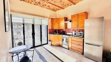 Fridge, stovetop, coffee/tea maker, cookware/dishes/utensils