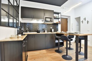 Fridge, microwave, stovetop, coffee/tea maker