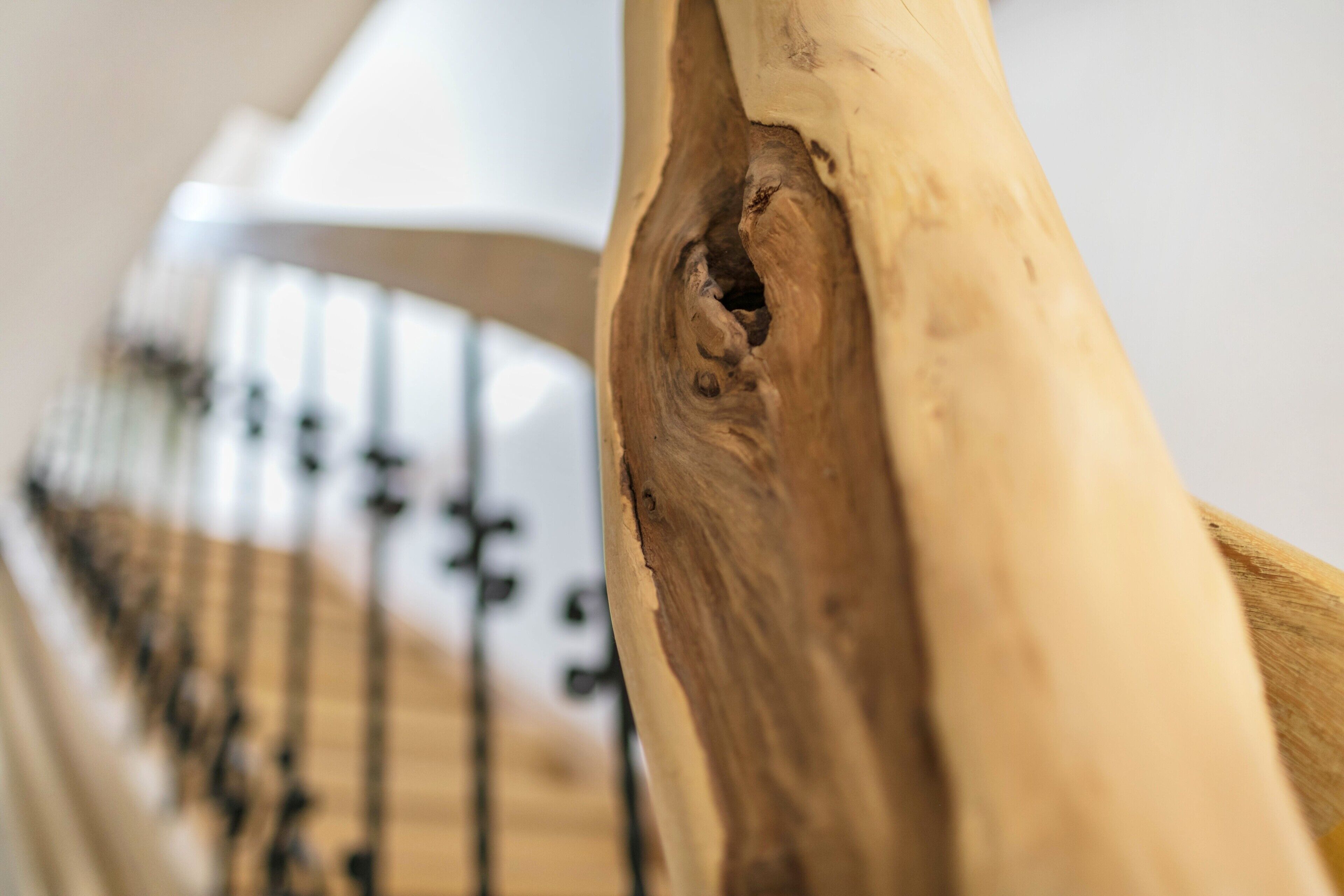 A close-up of a wooden structure with a carved detail.