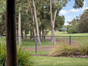 A fenced area with trees and a sign indicating the 10th tee. - Bickley s Place A Luxury Retreat on the Golf green (Dunsborough)