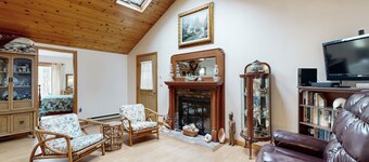 Quaint home across from bike paths with large furnished deck, grill, & W/D