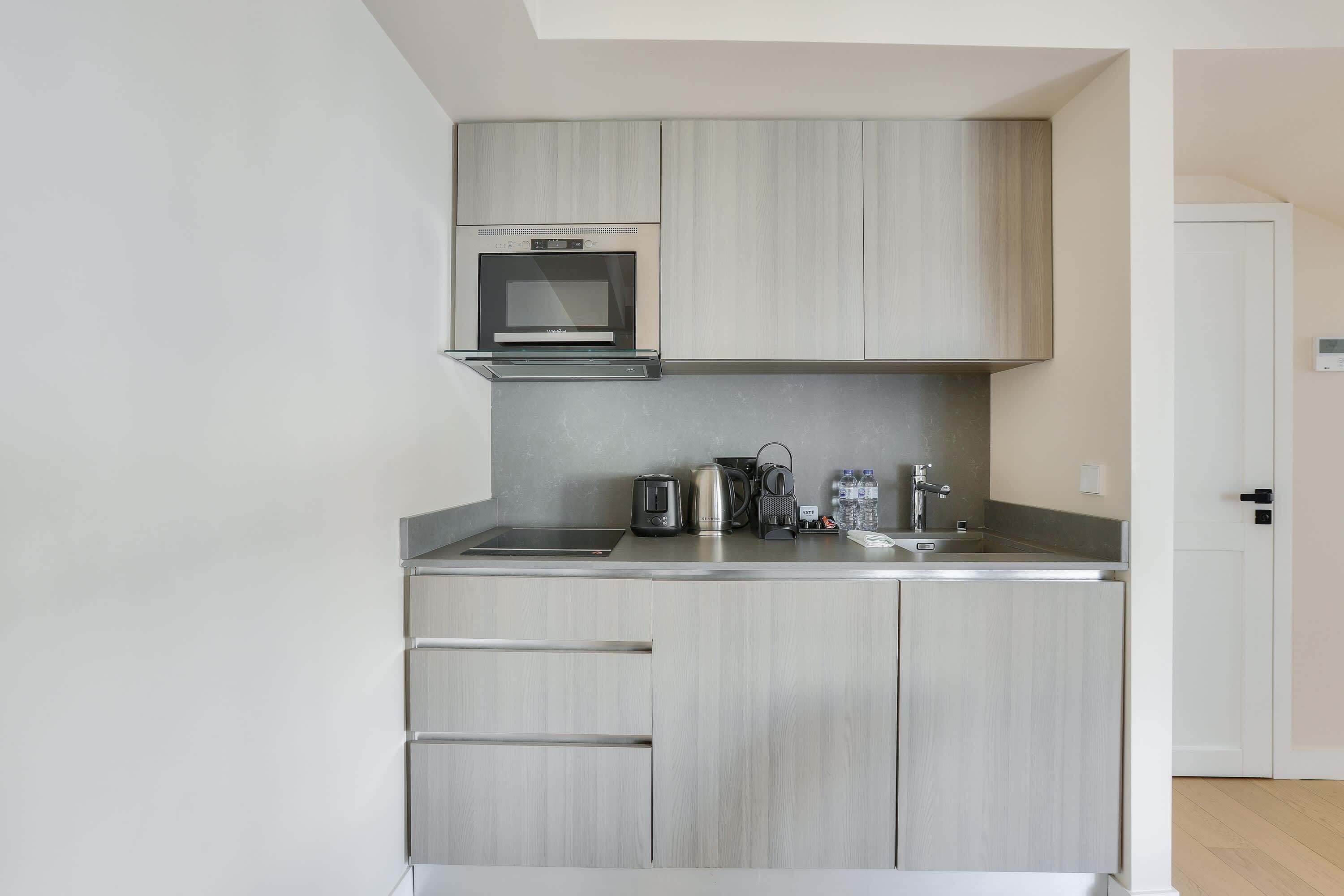 Fridge, microwave, stovetop, coffee/tea maker