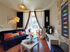 TV, fireplace, books