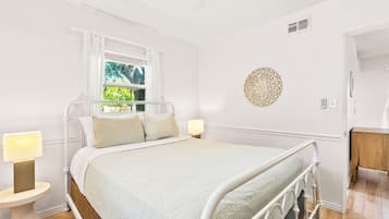 1 bedroom, desk, iron/ironing board, travel crib