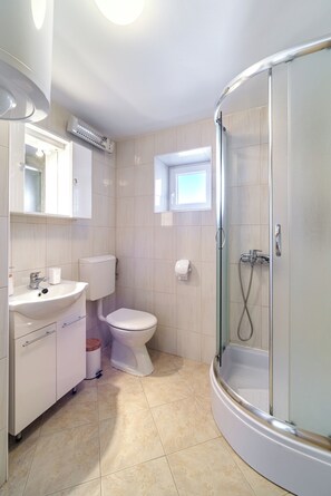 Shower, hair dryer, towels, soap