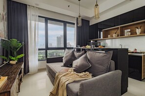 Junior Studio Suite | Living area | 32-inch LCD TV with digital channels, Netflix, streaming services