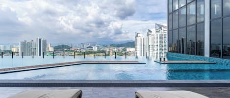 Outdoor pool, open 7:00 AM to midnight, pool loungers