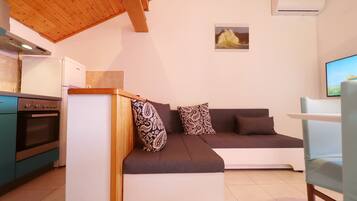 Apartment (Standard Two Bedroom Apartment) | Living room | 32-inch flat-screen TV with digital channels